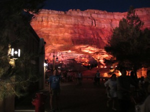 meredith in front of fake arch in cars land